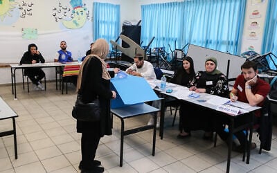 Arab Israelis cast their vote at a voting station in Tayibe, during the Knesset election on November 1, 2022. (Jamal Awad/Flash90) Arab Israelis cast their vote at a voting station in Tayibe, during the Knesset election on November 1, 2022. (Jamal Awad/Flash90)