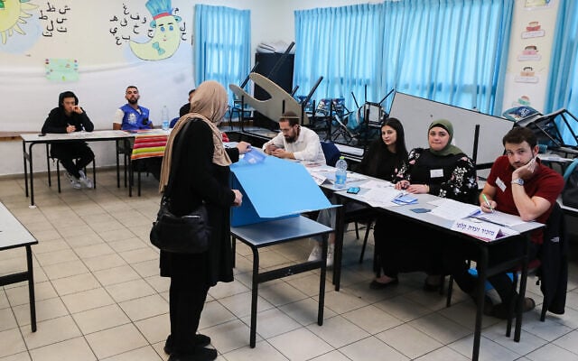 Arab Israelis cast their vote at a voting station in Tayibe, during the Knesset election on November 1, 2022. (Jamal Awad/Flash90)