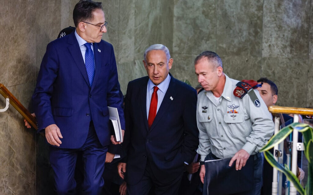 Prime Minister Benjamin Netanyahu arrives for a cabinet meeting at the Prime Minister’s Office in Jerusalem on January 22, 2023. At right is his military secretary, Maj. Gen. Avi Gil. At left is his chief of staff Tzachi Braverman. (Olivier Fitoussi/FLASH90) Prime Minister Benjamin Netanyahu arrives for a cabinet meeting at the Prime Minister’s Office in Jerusalem on January 22, 2023. At right is his military secretary, Maj. Gen. Avi Gil. At left is his chief of staff Tzachi Braverman. (Olivier Fitoussi/FLASH90)