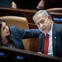 Prime Minister Benjamin Netanyahu with Minister of Transportation Miri Regev in the Knesset on February 20, 2023. (Yonatan Sindel/Flash90)