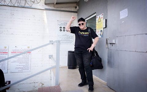 Anti-migrant activist Sheffi Paz, surrounded by supporters, arrives to enter the Neve Tirtza Women’s Prison in Ramle to serve a 45-day sentence after being convicted of vandalism, November 14, 2024. (Avshalom Sassoni/Flash90)