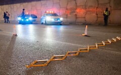 Illustrative: Police set up a temporary roadblock in Tel Aviv on December 31, 2024. (Dor Pazuelo/Flash90)