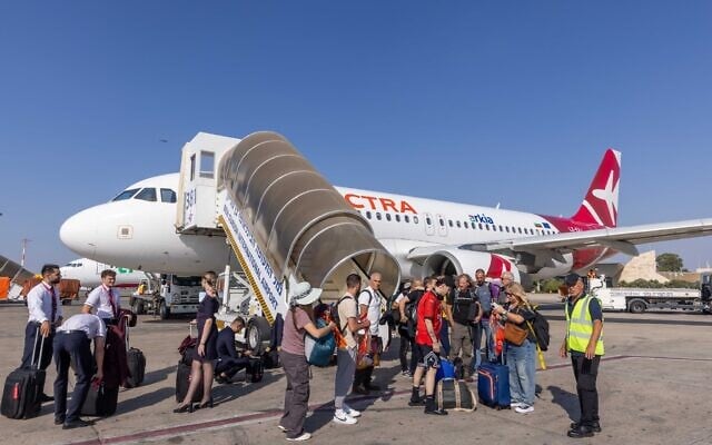 Travelers disembark an Electra plane at Ben Gurion International Airport. September 8, 2025. (Yossi Aloni/FLASH90)