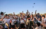 Members of Kibbutz Nahal Oz, near the Gaza border, celebrate the Shavuot festival at the kibbutz on May 22, 2026. (Tsafrir Abayov/Flash90)