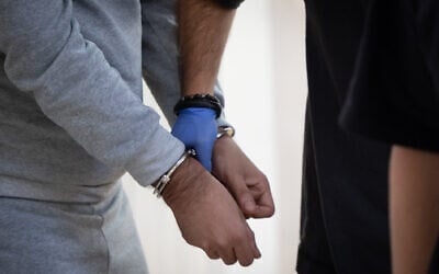 Illustrative: Arrested suspects at a hearing at the Jerusalem District Court August 18, 2026. (Chaim Goldberg/FLASH90) Illustrative: Arrested suspects at a hearing at the Jerusalem District Court August 18, 2026. (Chaim Goldberg/FLASH90)