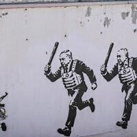 A mural titled “RUN” by artist aleXsandro Palombo depicts Prime Minister Benjamin Netanyahu and Gadi Eisenkot wearing bulletproof vests and carrying batons as they chase Bart Simpson, portrayed as a young Hamas terrorist, in Tel Aviv on September 29, 2026. (Avshalom Sassoni/Flash90)