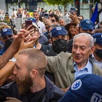 Prime Minister and Likud party chairman Benjamin Netanyahu, surrounded by supporters, during an election campaign tour in the southern Israeli city of Ashdod, September 29, 2026. (Liron Moldovan/Flash90)