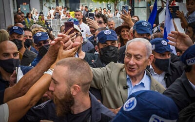 Prime Minister and Likud party chairman Benjamin Netanyahu, surrounded by supporters, during an election campaign tour in the southern Israeli city of Ashdod, September 29, 2026. (Liron Moldovan/Flash90) Prime Minister and Likud party chairman Benjamin Netanyahu, surrounded by supporters, during an election campaign tour in the southern Israeli city of Ashdod, September 29, 2026. (Liron Moldovan/Flash90)