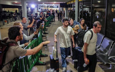 Passengers from flydubai flight FZ1073 walk with their family members through the arrivals hall at Ben Gurion International Airport near Tel Aviv, September 30, 2026. (Flash90) Passengers from flydubai flight FZ1073 walk with their family members through the arrivals hall at Ben Gurion International Airport near Tel Aviv, September 30, 2026. (Flash90)