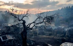 Illustrative: Palestinian firefighters extinguish a fire at a scrapyard following an alleged attack by extremist Israeli settlers in the Palestinian village of Ein Yabrud, near Ramallah in the West Bank, October 4, 2026. (Flash90)