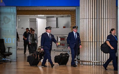 Air crew members are seen at Ben Gurion International Airport near Tel Aviv, October 7, 2026. (Avshalom Sassoni/Flash90)