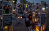 Family members and visitors gather at the Nova music festival memorial site near Kibbutz Re’im in southern Israel on the morning of October 7, 2026, three years after hundreds of people were murdered by Hamas terrorists at the site during the October 7 massacre. (Chaim Goldberg/Flash90)