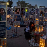 Family members and visitors gather at the Nova music festival memorial site near Kibbutz Re’im in southern Israel on the morning of October 7, 2026, three years after hundreds of people were murdered by Hamas terrorists at the site during the October 7 massacre. (Chaim Goldberg/Flash90)