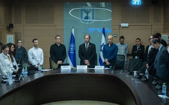 Members of the Knesset Constitution, Law and Justice Committee observe a minute of silence in memory of those murdered in the October 7, 2023 massacre, during a committee hearing, October 7, 2026. (Chaim Goldberg/Flash90) Members of the Knesset Constitution, Law and Justice Committee observe a minute of silence in memory of those murdered in the October 7, 2023 massacre, during a committee hearing, October 7, 2026. (Chaim Goldberg/Flash90)