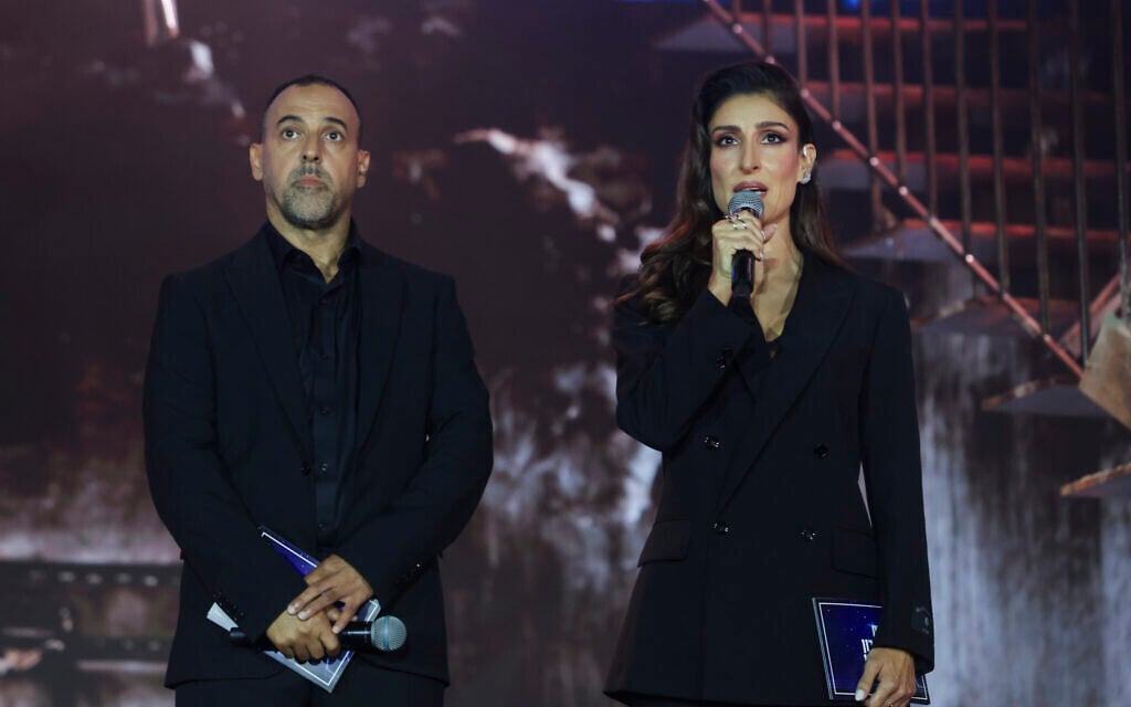 Former hostage Eli Sharabi and actress Shani Cohen host the national memorial ceremony marking three years since the October 7 massacre, at Yarkon Park in Tel Aviv, October 7, 2026. (Miriam Alster/Flash90)