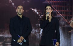 Former hostage Eli Sharabi and actress Shani Cohen host the national memorial ceremony marking three years since the October 7 massacre, at Yarkon Park in Tel Aviv, October 7, 2026. (Miriam Alster/Flash90)
