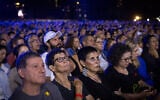 Families and people attend the national memorial ceremony marking three years since the October 7, 2023, Hamas attack, at Yarkon Park in Tel Aviv, October 7, 2026. (Miriam Alster/Flash90)