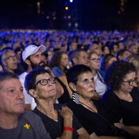 Families and people attend the national memorial ceremony marking three years since the October 7, 2023, Hamas attack, at Yarkon Park in Tel Aviv, October 7, 2026. (Miriam Alster/Flash90)