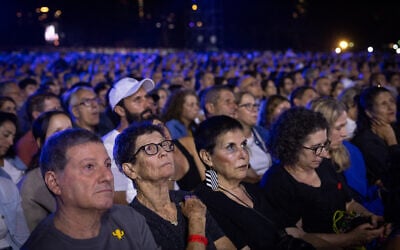 Families and people attend the national memorial ceremony marking three years since the October 7, 2023, Hamas attack, at Yarkon Park in Tel Aviv, October 7, 2026. (Miriam Alster/Flash90)