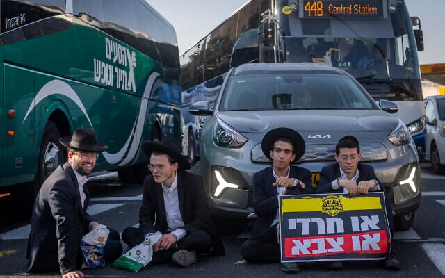 Ultra-Orthodox Jewish men block a road and clash with police during a protest against the jailing of yeshiva students who failed to comply with an army recruitment order, in Jerusalem, October 8, 2026. (Chaim Goldberg/Flash90) Ultra-Orthodox Jewish men block a road and clash with police during a protest against the jailing of yeshiva students who failed to comply with an army recruitment order, in Jerusalem, October 8, 2026. (Chaim Goldberg/Flash90)