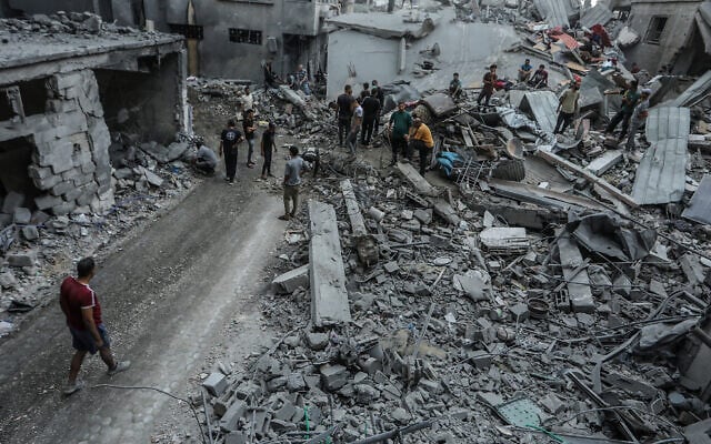 Palestinians inspect the damage following an Israeli airstrike in Khan Yunis, in the southern Gaza Strip, October 9, 2026. (Abed Rahim Khatib/Flash90)