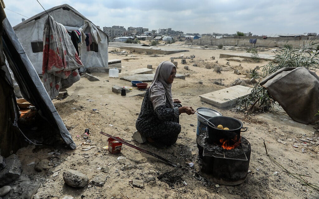 Displaced Palestinians living in a cemetery in central Khan Younis, in the southern Gaza Strip, after being unable to return to their homes, which were destroyed during the war between Israel and Hamas, October 10, 2026. (Abed Rahim Khatib/Flash90) Displaced Palestinians living in a cemetery in central Khan Younis, in the southern Gaza Strip, after being unable to return to their homes, which were destroyed during the war between Israel and Hamas, October 10, 2026. (Abed Rahim Khatib/Flash90)
