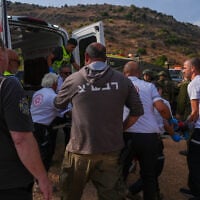 Israeli security and rescue forces evacuate injured people near the site where unexploded ordnance detonated during a school trip, near Kibbutz Yiftah in the Ramim Ridge area, close to the Israeli border with Lebanon, October 12, 2026. (Ayal Margolin/Flash90)
