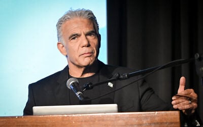 Opposition Leader Yair Lapid speaks at a conference on October 12, 2026. (Avshalom Sassoni/FLASH90)
