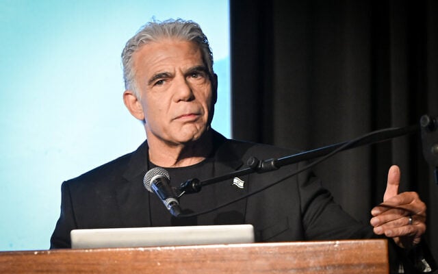 Opposition Leader Yair Lapid speaks at a conference on October 12, 2026. (Avshalom Sassoni/FLASH90)