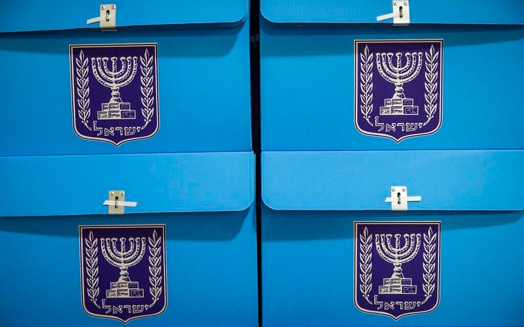 Workers prepare ballot boxes for the upcoming election at the Central Elections Committee warehouse in Shoham, ahead of their distribution to polling stations across the country, October 14, 2026. (Yonatan Sindel/Flash90) Workers prepare ballot boxes for the upcoming election at the Central Elections Committee warehouse in Shoham, ahead of their distribution to polling stations across the country, October 14, 2026. (Yonatan Sindel/Flash90)