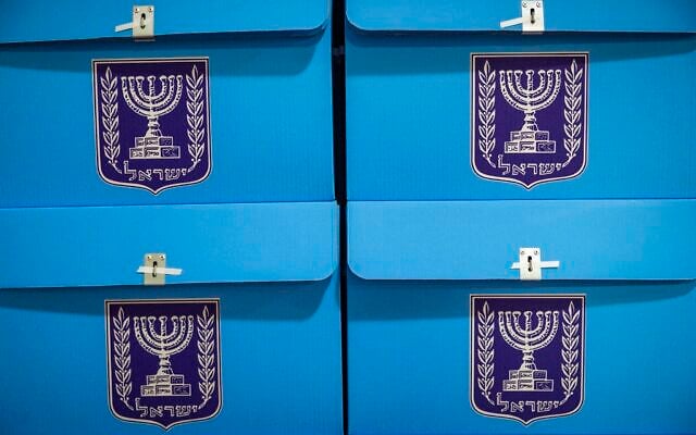 Workers prepare ballot boxes for the upcoming election at the Central Elections Committee warehouse in Shoham, ahead of their distribution to polling stations across the country, October 14, 2026. (Yonatan Sindel/Flash90)