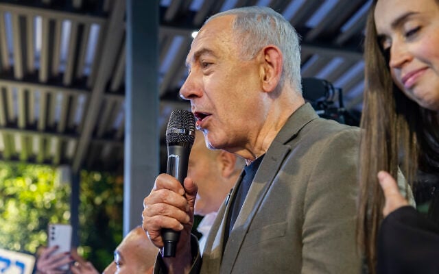 Prime Minister Benjamin Netanyahu visits supporters in Haifa, ahead of Israel’s upcoming general election, October 14, 2026. (Sharon Leibel/Flash90)