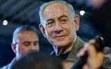 Prime Minister Benjamin Netanyahu, the Likud party chairman, visits supporters in the northern city of Haifa, ahead of the upcoming election, October 14, 2026. (Sharon Leibel/Flash90)