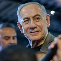 Prime Minister Benjamin Netanyahu, the Likud party chairman, visits supporters in the northern city of Haifa, ahead of the upcoming election, October 14, 2026. (Sharon Leibel/Flash90)