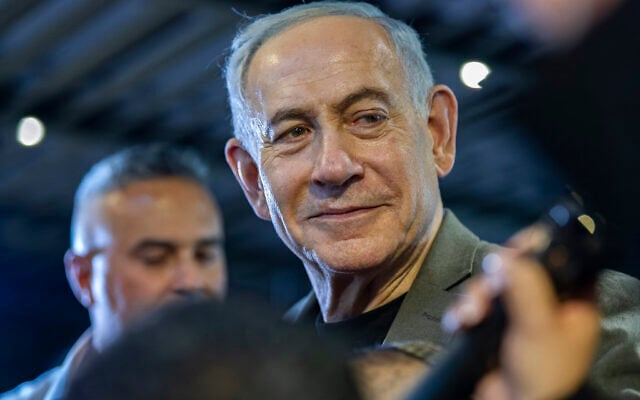 Prime Minister Benjamin Netanyahu, the Likud party chairman, visits supporters in the northern city of Haifa, ahead of the upcoming election, October 14, 2026. (Sharon Leibel/Flash90)