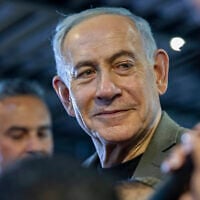 Prime Minister Benjamin Netanyahu, the Likud party chairman, visits supporters in the northern city of Haifa, ahead of the upcoming election, October 14, 2026. (Sharon Leibel/Flash90)
