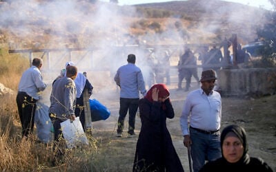 Israeli security forces fire tear gas and disperse Palestinian farmers, preventing them from continuing the olive harvest as they attempt to cross an iron gate erected by the army in the village of Salem, east of Nablus in the West Bank, October 17, 2026. (Nasser Ishtayeh/Flash90)