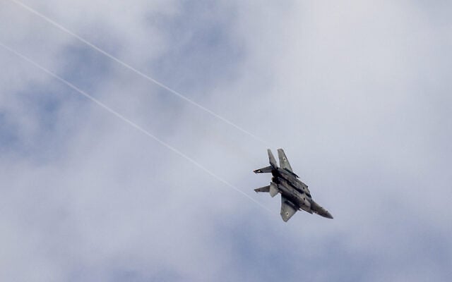 An Israeli fighter jet is seen in the skies over central Israel, October 18, 2026. (Nati Shohat/Flash90)