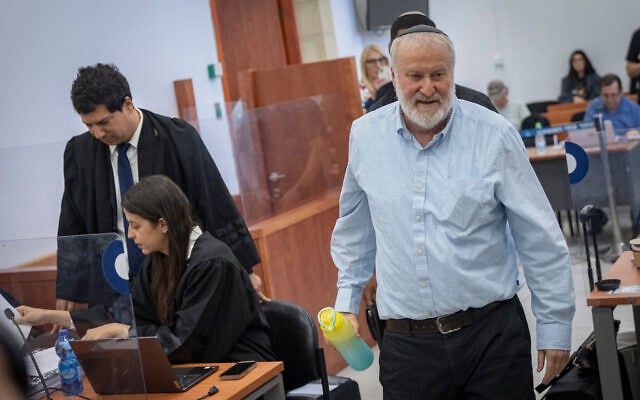 Former attorney general Avichai Mandelblit arrives to testify in the corruption trial of Prime Minister Benjamin Netanyahu at the Jerusalem District Court, October 20, 2026, as Netanyahu's attorney Amit Hadad stands in the background. (Chaim Goldberg/Flash90) Former attorney general Avichai Mandelblit arrives to testify in the corruption trial of Prime Minister Benjamin Netanyahu at the Jerusalem District Court, October 20, 2026, as Netanyahu's attorney Amit Hadad stands in the background. (Chaim Goldberg/Flash90)