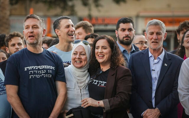 Democrats party chairman Yair Golan (L) and party members and members of the public attend a memorial ceremony marking the 31st anniversary of the assassination of former prime minister Yitzhak Rabin, at the site where he was murdered in Rabin Square, Tel Aviv, October 22, 2026. (Miriam Alster/Flash90)