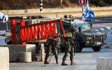 Israeli security forces guard a closed checkpoint at the entrance to the West Bank city of Hebron, following a deadly shooting attack in the area the previous day, October 24, 2026. (Wisam Hashlamoun/Flash90)