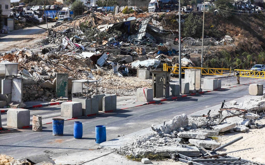 A view of the scene of a deadly shooting attack at the Yehuda Junction checkpoint near the West Bank city of Hebron, where two Israeli soldiers were murdered and three others wounded by Palestinian gunmen the previous day, October 24, 2026. (Wisam Hashlamoun/Flash90) A view of the scene of a deadly shooting attack at the Yehuda Junction checkpoint near the West Bank city of Hebron, where two Israeli soldiers were murdered and three others wounded by Palestinian gunmen the previous day, October 24, 2026. (Wisam Hashlamoun/Flash90)