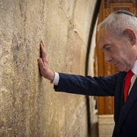 Prime Minister Benjamin Netanyahu prays at the Western Wall in Jerusalem’s Old City, the day before Israel's general elections, October 26, 2026. (Chaim Goldberg/Flash90)