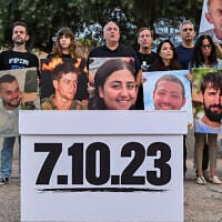 Bereaved families who lost loved ones in the October 7, 2023, Hamas-led massacre observe a minute of silence and deliver a special statement at Hostages Square in Tel Aviv on the morning of the national election, October 27, 2026. (Avshalom Sassoni/Flash90)