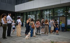 Israelis arrive to cast their ballots in the national election at a polling station in Herzliya, October 27, 2026. (Chaim Goldberg/Flash90)