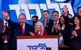Prime Minister Benjamin Netanyahu, the Likud party chairman, waves at the Likud party’s election headquarters in Jerusalem, following the election, early October 28, 2026. (Chaim Goldberg/Flash90)