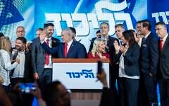 Prime Minister Benjamin Netanyahu waves to supporters at the Likud party’s election headquarters in Jerusalem, early October 28, 2026. (Chaim Goldberg/Flash90)