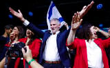 Democrats chairman Yair Golan and members of his party celebrate at the party’s election headquarters in Tel Aviv, following the release of exit poll results, October 27, 2026. (Yehoshua Yosef/Flash90)