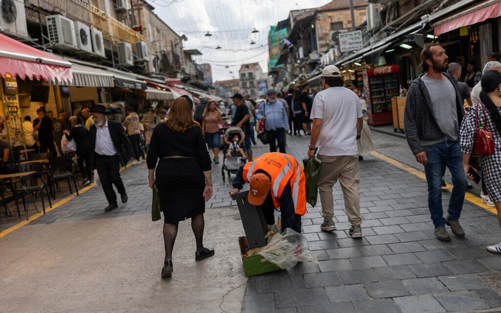 People walk through the Mahane Yehuda Market in Jerusalem, a day after Israel’s election, October 28, 2026. (Yonatan Sindel/Flash90) People walk through the Mahane Yehuda Market in Jerusalem, a day after Israel’s election, October 28, 2026. (Yonatan Sindel/Flash90)