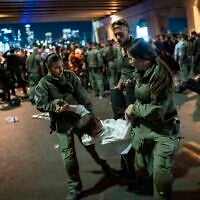 Ultra-Orthodox Jewish men block a road and clash with police during a protest against the jailing of yeshiva students who failed to comply with an army recruitment order, outside the ultra-Orthodox city of Bnei Brak, October 29, 2026. (Flash90)